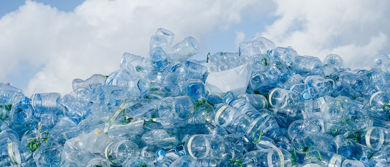 A large mountain of plastic bottles.